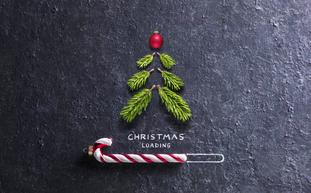 Christmas Loading Concept - Tree And Candy Canes On Black Stone